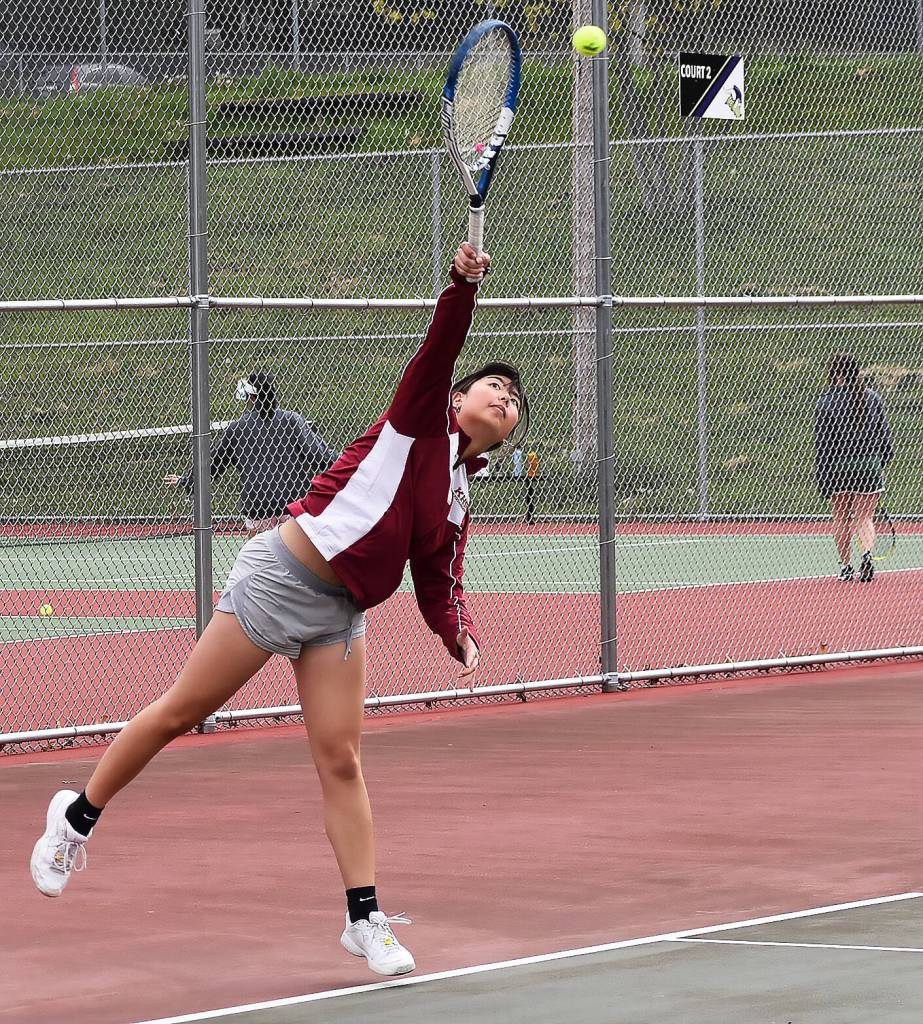 Izzy Kim leads Kingston to a doubles win.