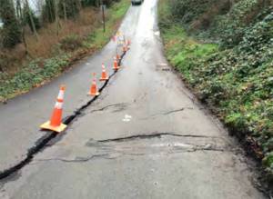 Big cracks in the middle of Washington Boulevard in downtown Kingston before work was done. Kitsap Public Works courtesy photo