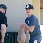 9-year-old Reese packs up some meat for distribution.