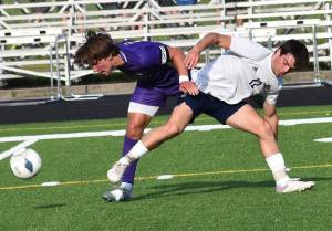Mason Chmielewski fights for a ball at midfield. Nicholas Zeller-Singh/Kitsap News Group Photos