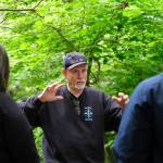Al Phillips talks to visitors on a recent tour of his property, called Dolphin Place Open Space.