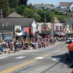 People line Front Street in downtown Poulsbo in anticipation of the Viking Fest parade.