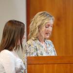 Andrea Paine (right) testifies against the location of the homeless shelter with her daughter.