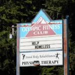 The sign of the old Olympic Fitness Club reads "Help Homeless" Elisha Meyer/Kitsap News Group Photos