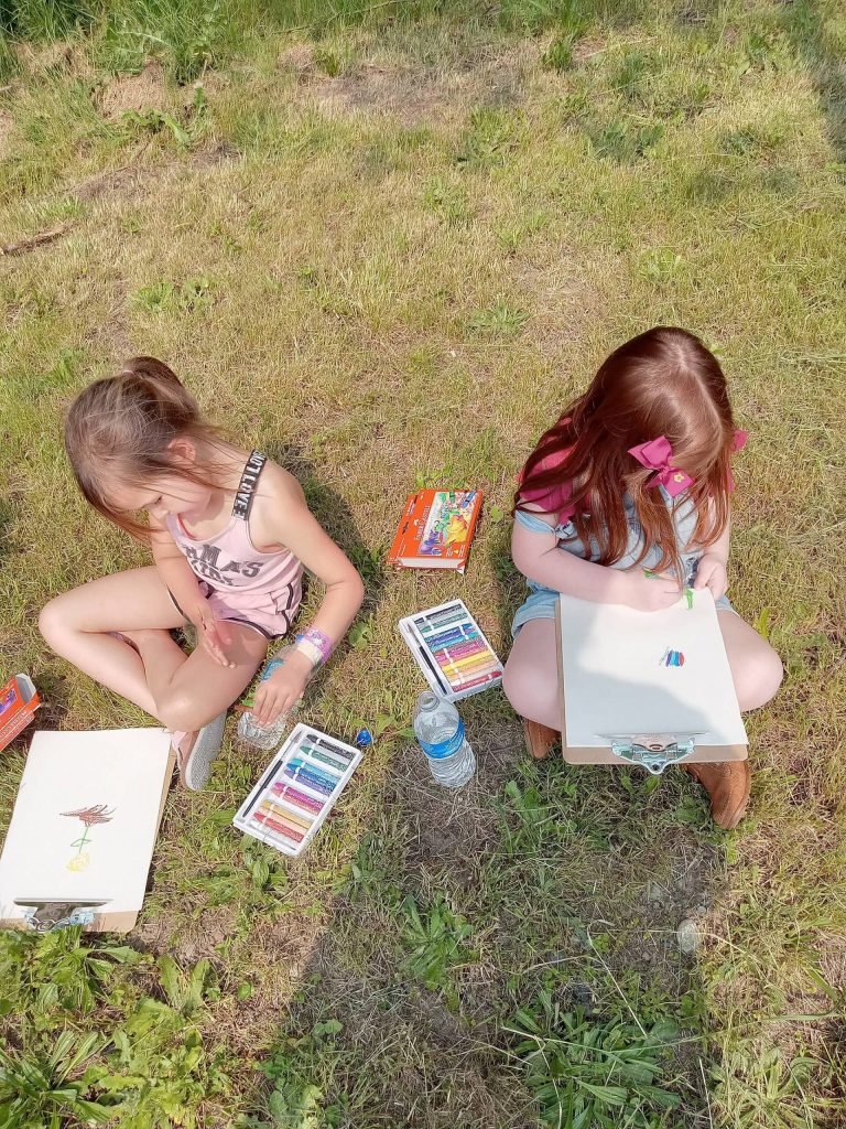 Eleanor and Aubrey, kindergarten, practice open air painting during class.