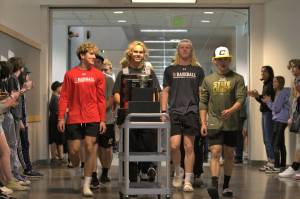 Elisha Meyer/Kitsap News Group 
The Klahowya baseball team parades down the school hall surrounded by applauding students and faculty one week after the team claimed a state championship.