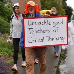 Community members march along Madison Avenue during the Freedom to Learn March in Winslow June 10.