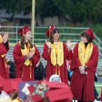 Valedictorians take the stage and receieve applause.
