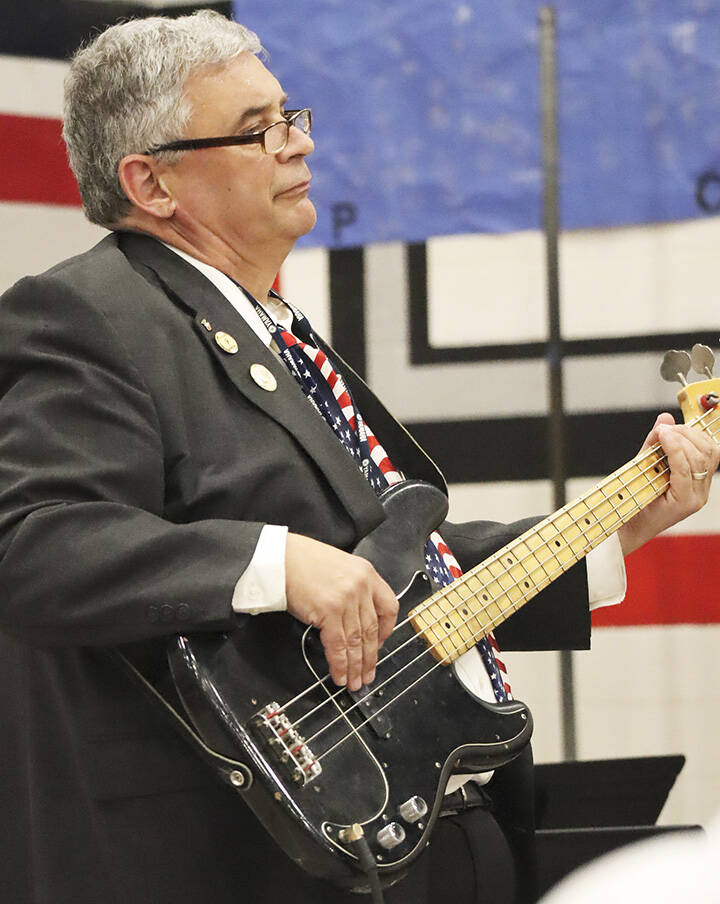 Haag playing the bass guitar at his final concert at KMS.