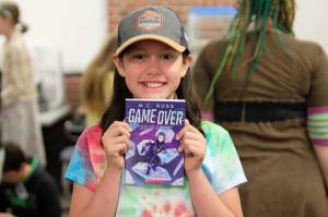 Evie shows off her selection from the PTSO book giveaway at Orchard Heights. Elisha Meyer/Kitsap News Group Photos