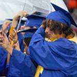 Bremerton High School students change their tassels, officially marking them graduates.