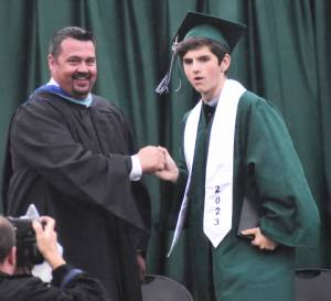 Over one hundred Klahowya graduates walk across the stage to receive their high school diplomas. Nicholas Zeller-Singh/Kitsap News Group Photos
