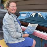 Stina Tillotson sits at the piano she donated for the public piano project. Nancy Treder/Kitsap News Group Photos
