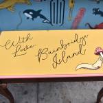 A slug is prominently featured on the bench.