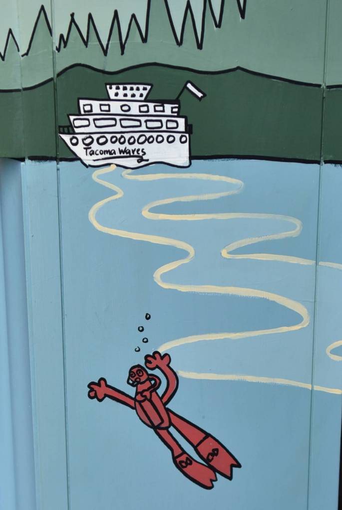 Detail of the a ferry and scuba diver on the side of the piano.