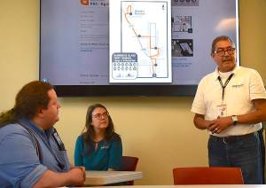 Nancy Treder/Kitsap News Group
Kitsap Transit employees share information at the commuter workshop June 22 at the Bainbridge Island Museum of Art for island employers.