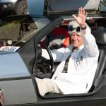Elisha Meyer/Kitsap News Group Photos 
Doc Brown gives a wave to the crowd from his DeLorean.