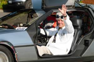 Elisha Meyer/Kitsap News Group Photos 
Doc Brown gives a wave to the crowd from his DeLorean.