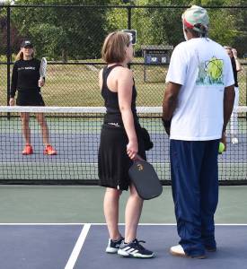 Madeleine Lapke teaches the rules of pickleball during the tour at the Founders Courts. Nicholas Zeller-Singh/Kitsap News Group Photos