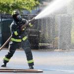 A firefighter works the hose during a training exercise for South Kitsap Fire and Rescue. Elisha Meyer/Kitsap News Group Photos