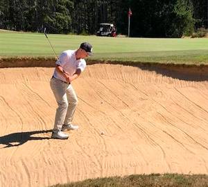 Mike De Felice/Kitsap News Group 
One course installed a practice sand trap area to help golfers like this one.