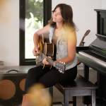 Lydia Ramsey courtesy photos
Ramsey playing guitar in her home studio in Indianola.