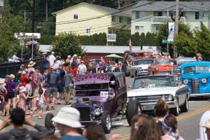 Classic cars make their way through the Kingston 4th of July parade. Tyler Shuey/Kitsap News Group Photos