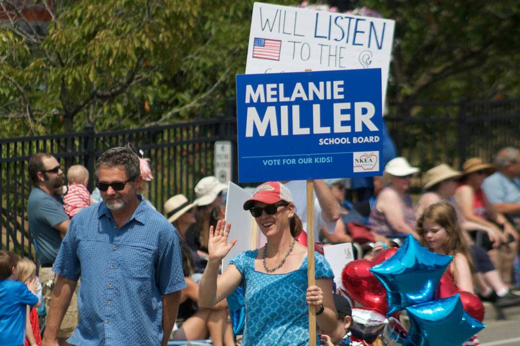 North Kitsap school board candidate Melanie Miller makes her way through the Kingston 4th of July parade.