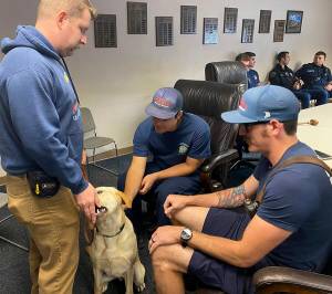 Stepen Gutschow shows Chadwick to his co-workers. SKFR courtesy photo