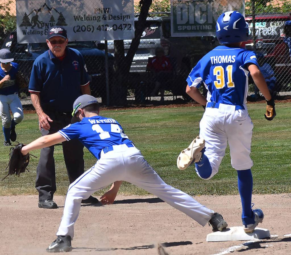 Dalton Watson reaches out to make a play at first base.