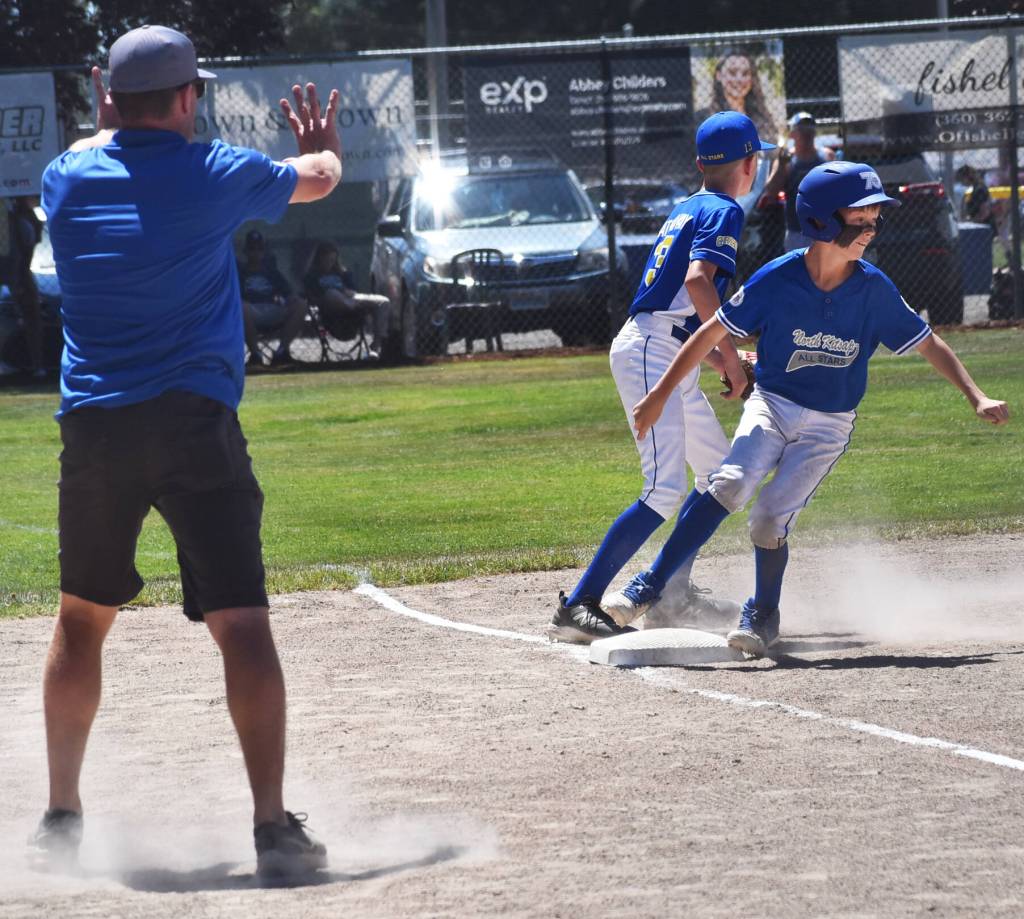 Ryan Bradley stops the runner at third base after a base hit.