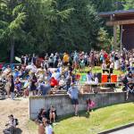 Hundreds of spectators watch canoes arrive at Suquamish on the sixth day of the Canoe Journey on the Salish Sea.