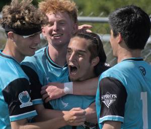 Kolby Juarez, left, Connor Louden, Gabe Threadgold and Peter Radovich celebrate Threadgolds second-half penalty kick conversion giving Port Orchard its first lead of the match. Jesse MacKenzie courtesy photos