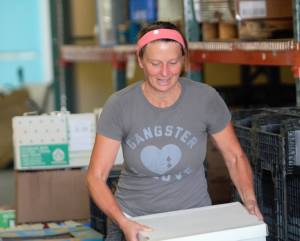 Elisha Meyer/Kitsap News Group
Cori Kauk moves around some boxes during a major clean-up.
