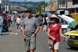 Elisha Meyer/Kitsap News Group Photos
Large crowds walk down the center of Bay Street surrounded by the classic cars at The Cruz in downtown Port Orchard Aug. 13.