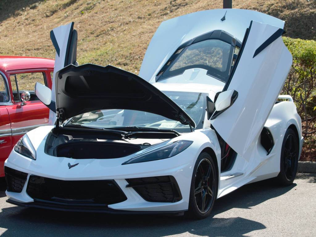 A more modern entry, all doors of this white Corvette are open for visitors to take a look.
