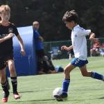 Nicholas Zeller-Singh/Kitsap News Group Photos
The Island Cup, which brings 89 soccer teams of all ages to Bainbridge Island, is taking place this weekend at Battle Point Park, Woodward Middle and Bainbridge High. BI Football Club is one of the teams. Here, Brady Treve dribbles into the opponents defense.