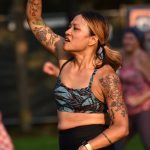 Janna Chan creates a striking pose during the Zumba Dance for Maui fundraiser Aug. 25 at Town Center.