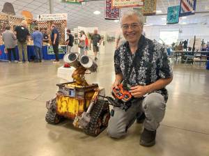 Elisha Meyer/Kitsap News Group
Robert Zollna kneels next to his proud creation, an ultra-realistic WALL-E robot.