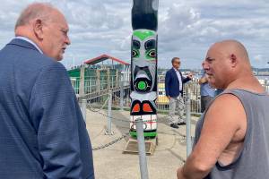 Elisha Meyer/Kitsap News Group Photos
Councilman John Clauson (left) and Bill Martin Jr. (right) connect over the restoration of the totem pole. The pole was a piece dedicated to the late Gerald H. Grosso, whom both men had connections to.