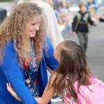 Susan Dukart, a teacher at South Colby Elementary, embraces a student on the first day back.
