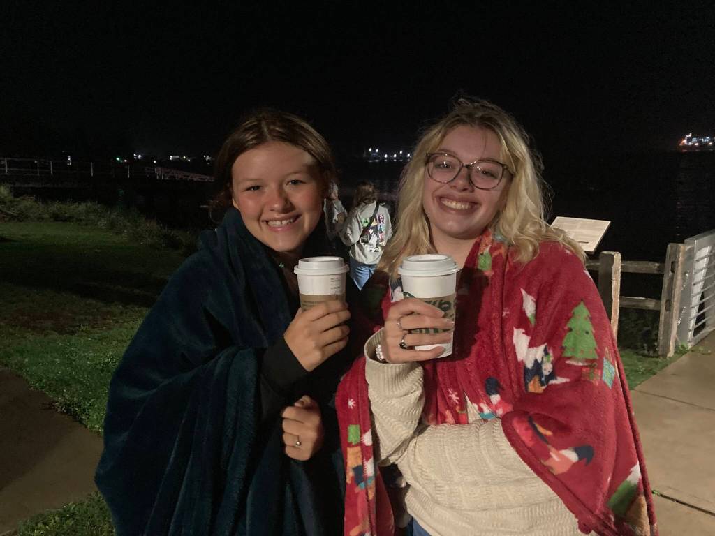 Delaney (left) and Lola (right) brave the cold morning with warm drinks and blankets aplenty.