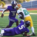 Vikings Morgan Paul and Cohen Meis make a tackle behind the line of scrimmage.