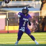 NKs Cole Edwards throws a touchdown after scrambling around the pocket.
