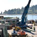 Nancy Treder/Kitsap News Group Photos
A crane is moved into place that will be used to set the walkway spans in place.