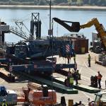 Nancy Treder/Kitsap News Group Photos
Construction workers on the Bainbridge Island ferry terminal prepare to transfer the first of the walkway spans Sept. 8.