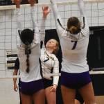 Bainbridges Rollins Anderson smashes the ball past two Vikings.