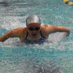 Trojan Jasmyn Coviello competes in the 200-yard medley relay.