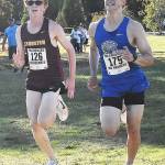 Nicholas Zeller-Singh/Kitsap News Group Photos
Kingstons Emmanuel Moes and Olympics Justin Jaramillo battle to the finish line.