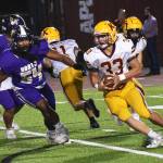 Kingstons Camden Singer evades Viking Enders Vailolo.